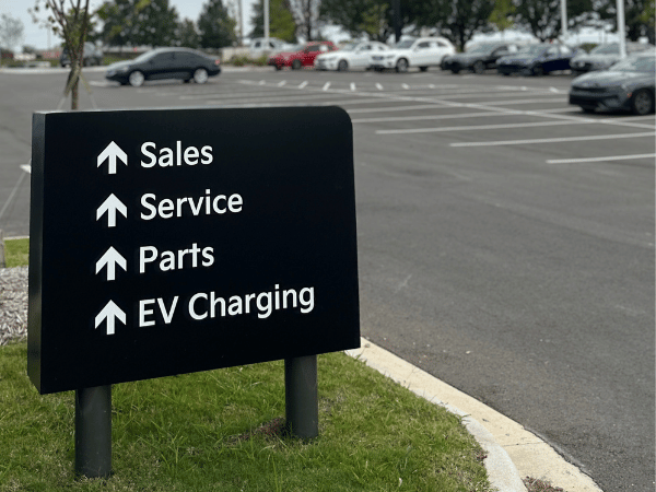 Crain Kia of Fayetteville Sign to Sales, Service, Parts, and EV Charging