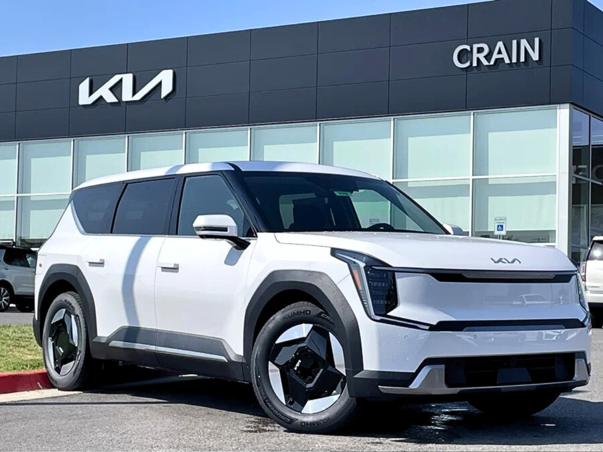 White 2026 Kia EV9 in Front of Crain Kia of Fayetteville